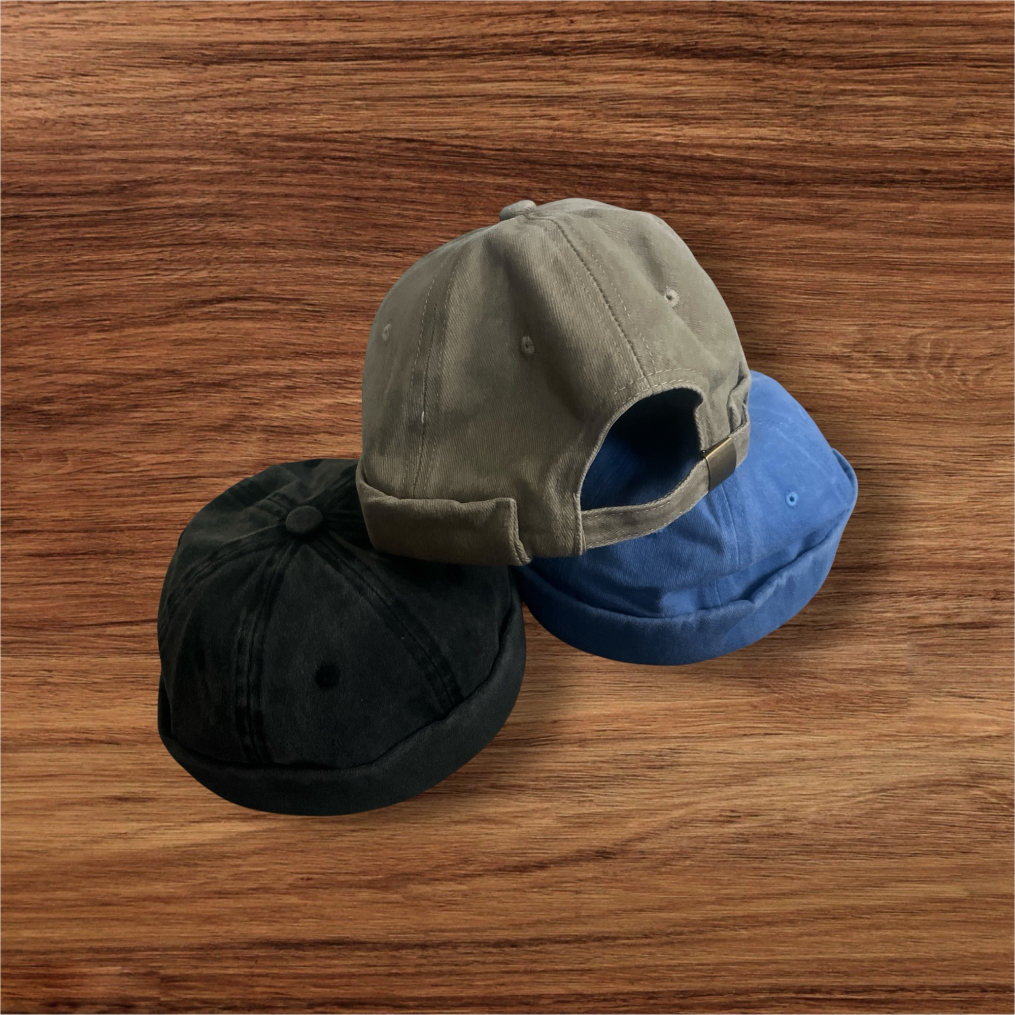 Peacefulcornerapparel distressed cotton docker hat in black, grey, and blue. Brimless cap with adjustable strap.