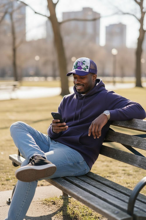 Peacefulcornerapparel embellished floral trucker hat with stars in purple and white, featuring mesh back and embroidered details.