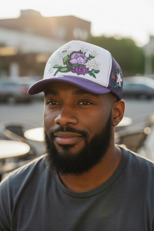 Peacefulcornerapparel embellished floral trucker hat in purple and white with rhinestones and mesh back.